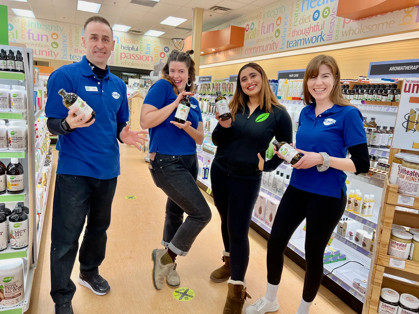 Kardish team members smiling in a store aisle